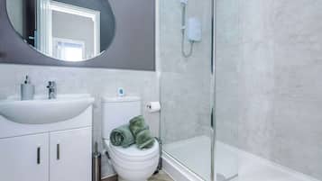 Shower, hair dryer, towels