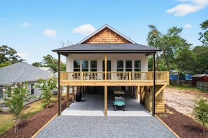 Exterior - Lux Oak Island Retreat | Walk to Beach | Golf Cart + Private Suite + Fenced Yard! (Oak Island)
