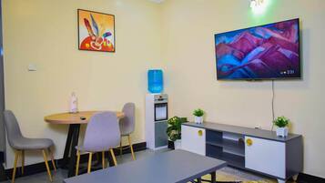 Classic Apartment, City View | Living area | 24-inch Smart TV with digital channels