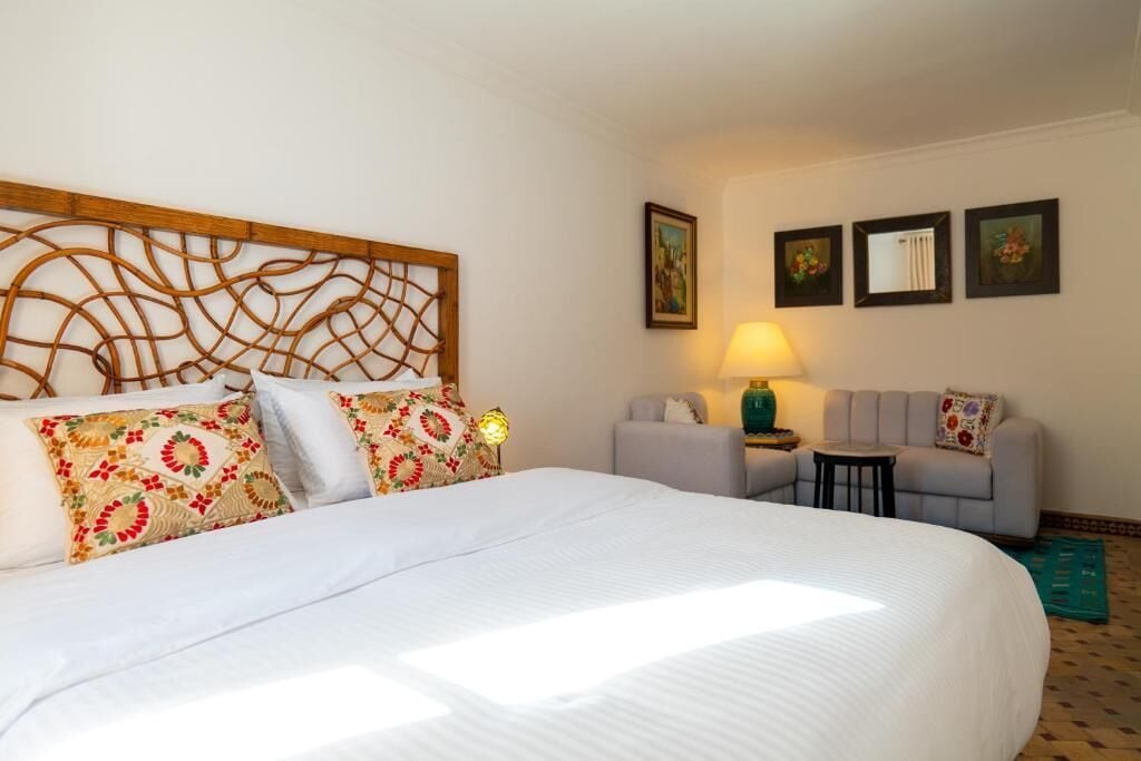 Senior Suite, 1 Queen Bed, City View | Individually decorated, individually furnished, iron/ironing board