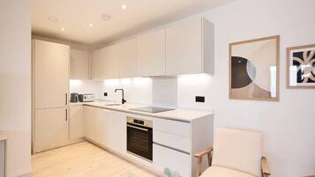 Fridge, oven, cookware/dishes/utensils