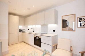 Fridge, oven, cookware/dishes/utensils
