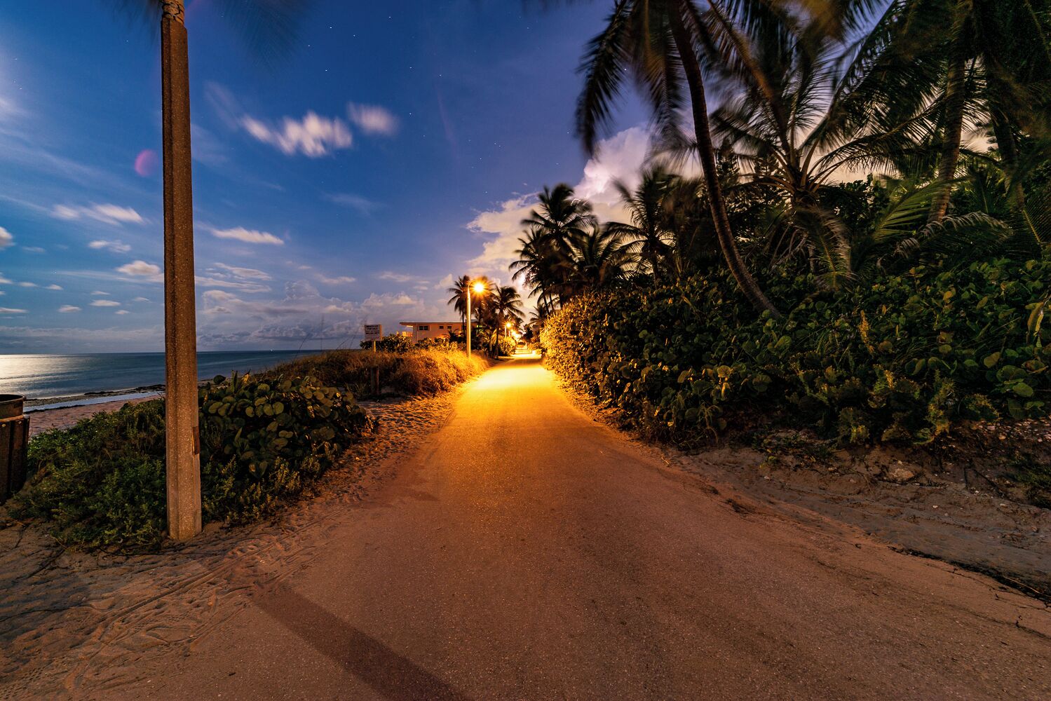 Beach nearby, white sand, beach umbrellas, beach towels