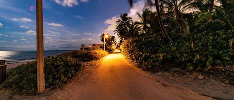 Beach nearby, white sand, beach umbrellas, beach towels