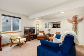 Smart TV, fireplace, table football, books