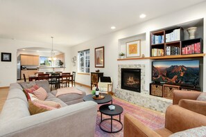 Smart TV, fireplace, table football, books