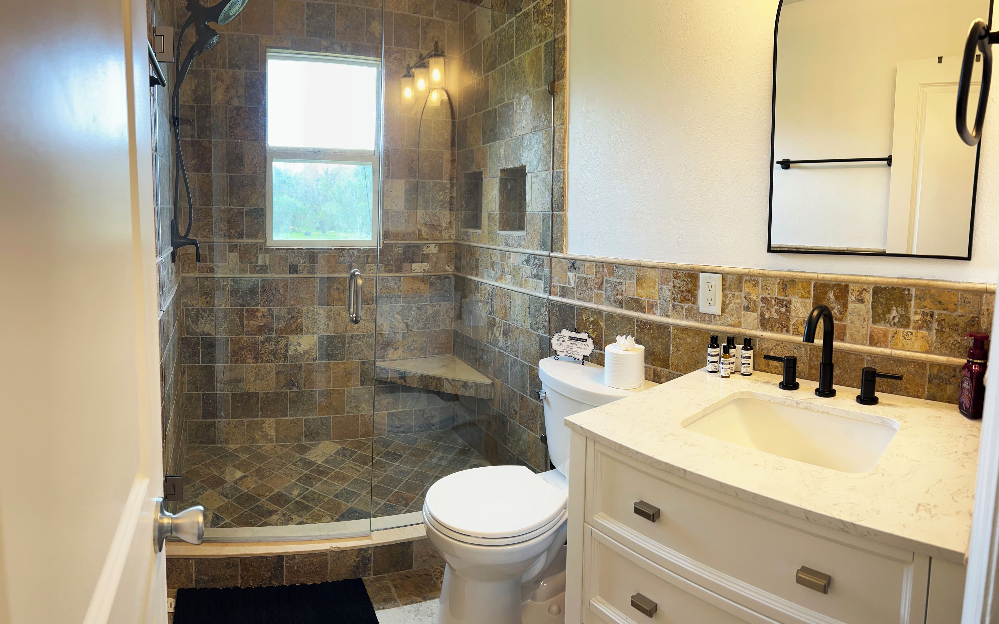 Shower, towels, soap, toilet paper