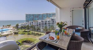 Outdoor dining - Beachfront apartment w/ pool & beach access (Nuevo Vallarta)
