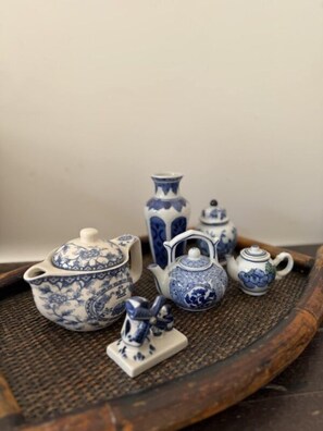A set of blue and white porcelain tea sets on a woven tray. - Sadele Hacımemiş (Cesme)