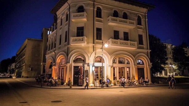 A historic building with a classic architectural style, featuring arched windows and a central entrance. - The Admiral / Luxury Apartment in Constanta (Unknown)