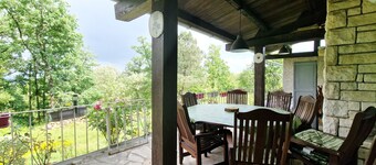 Large house with covered terrace in the countryside, panoramic view