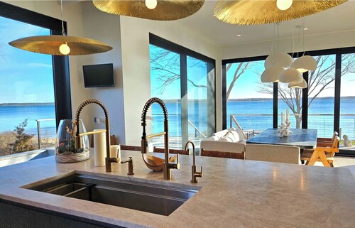 Modern Zen beach oasis with pool in Jamesport Bay.