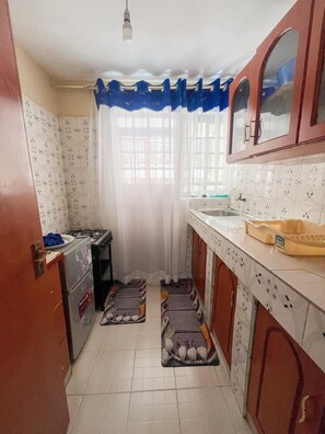Family Apartment, City View | Private kitchen | Fridge, microwave, cookware/dishes/utensils - Lux Suites Cabre Apartments (Nakuru)