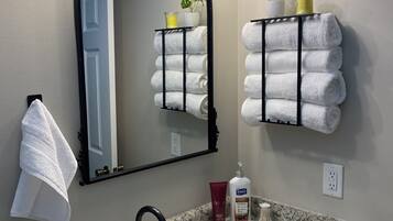 Shower, hair dryer, towels, soap