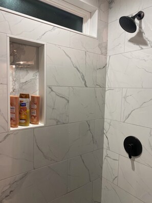 Shower, hair dryer, towels, soap