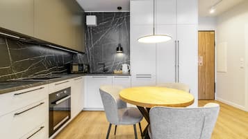 Deluxe Apartment, 1 Bedroom, Kitchenette, City View | In-room dining