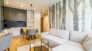 Deluxe Apartment, 1 Bedroom, Kitchenette, City View | Living room | 55-cm Smart TV with digital channels, Netflix, streaming services