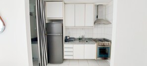 Fridge, oven, coffee/tea maker, cookware/dishes/utensils
