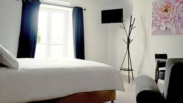 Premium bedding, memory-foam beds, desk, laptop workspace
