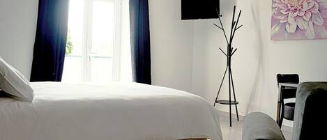 Premium bedding, memory-foam beds, desk, laptop workspace