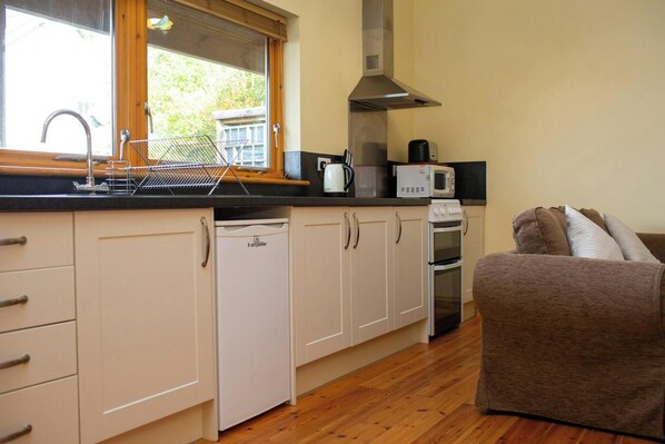 Fridge, microwave, toaster, cookware/dishes/utensils