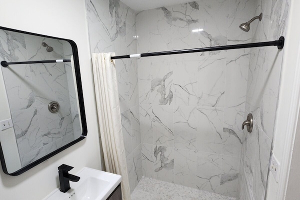 Shower, towels, soap, toilet paper