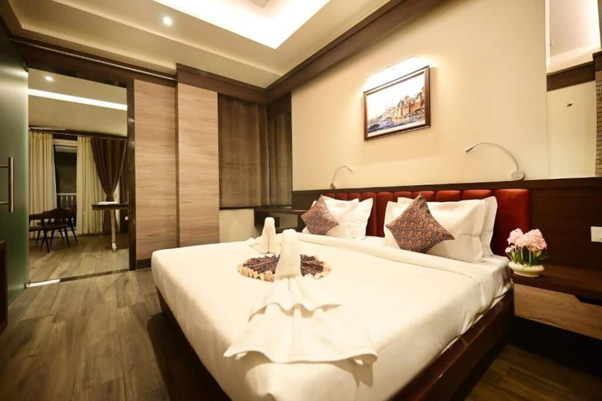 Luxury Suite, Balcony, City View | In-room safe, desk, laptop workspace, blackout drapes