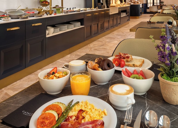 A breakfast buffet with various food items and a coffee station. - Catalonia Puerta Del Mar (Málaga)