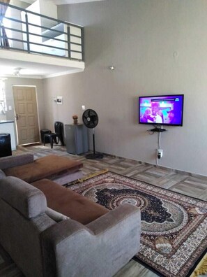 Comfort Apartment, Courtyard View | Living area | 32-inch plasma TV with satellite channels