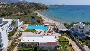A resort with a swimming pool, beach access, and a view of the sea. - The River Suites - Adults Only (Agios Nikolaos)