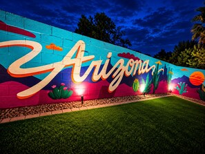 A mural with the word 'Arizona' and desert landscape.