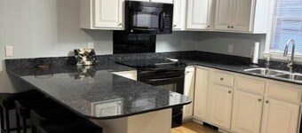 Sandy Beach Cottage sleeps 8 and has plenty of parking for your boat or jet ski.