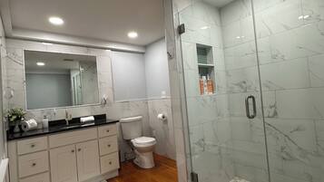 Shower, hair dryer, towels, soap