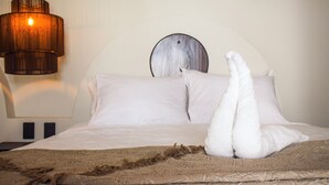 A neatly made bed with white linens and a brown throw blanket. - Selanna 2 Luna Creciente (El Paredon)