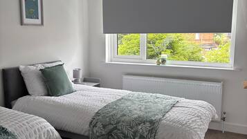 4 bedrooms, desk, iron/ironing board, travel cot