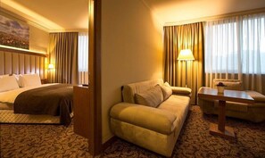 Deluxe Suite, City View | In-room safe, desk, laptop workspace, blackout drapes