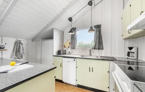 Fridge, stovetop, dishwasher, coffee/tea maker