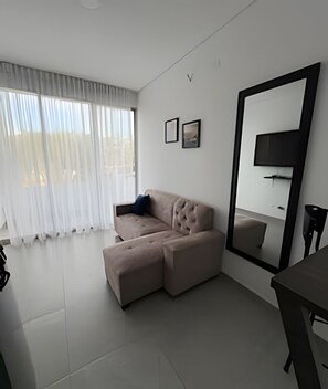 Deluxe Apartment | Living area | TV, heated floors - ALOJAMIENTOS LA MARTIN (Cali)