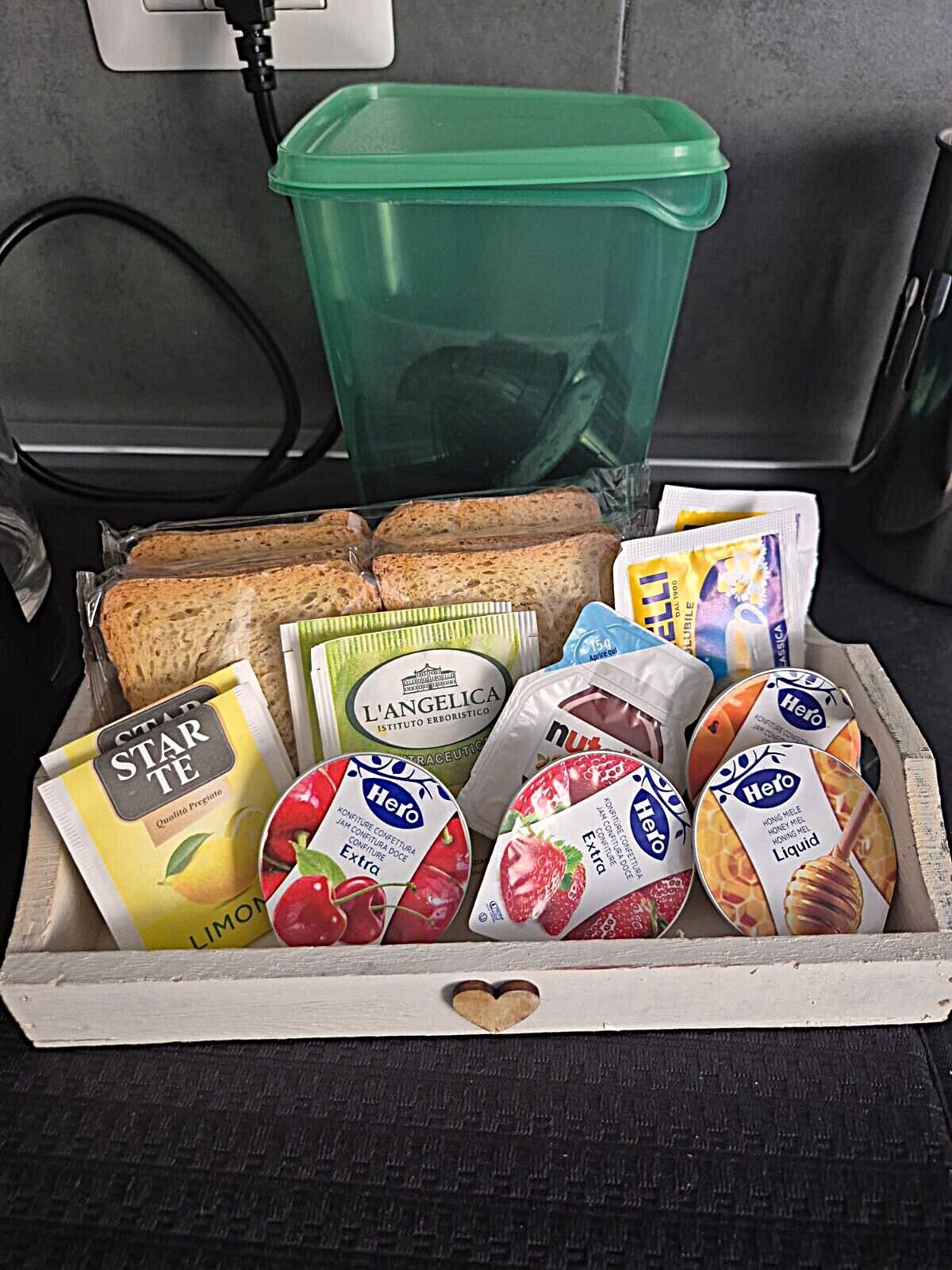 A box containing various food items including bread, packaged snacks, and dairy products.