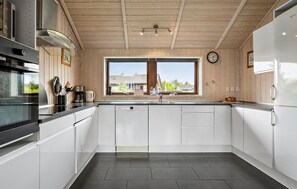 Fridge, stovetop, dishwasher, coffee/tea maker