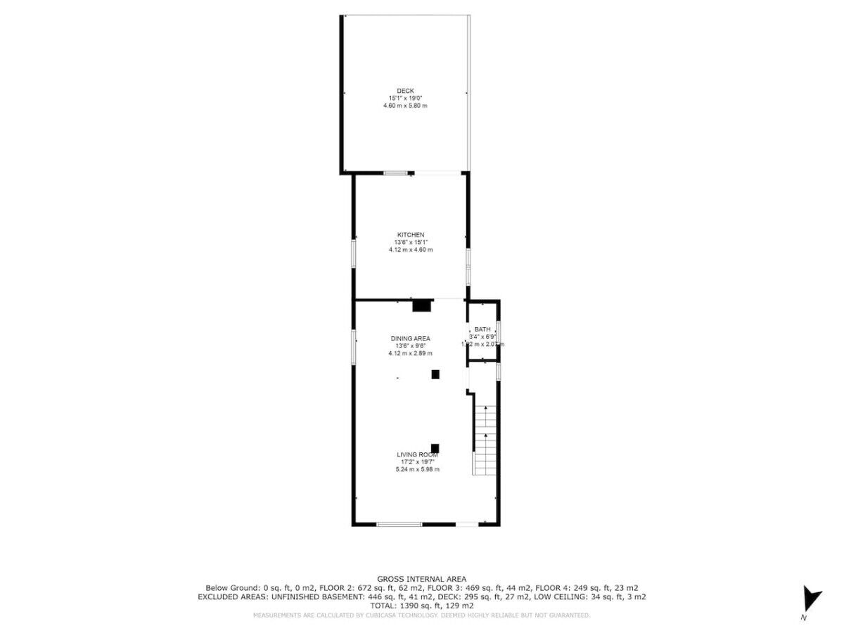 Grundriss eines Wohnhauses mit Terrasse, Küche, Essbereich, Wohnzimmer und Bad.