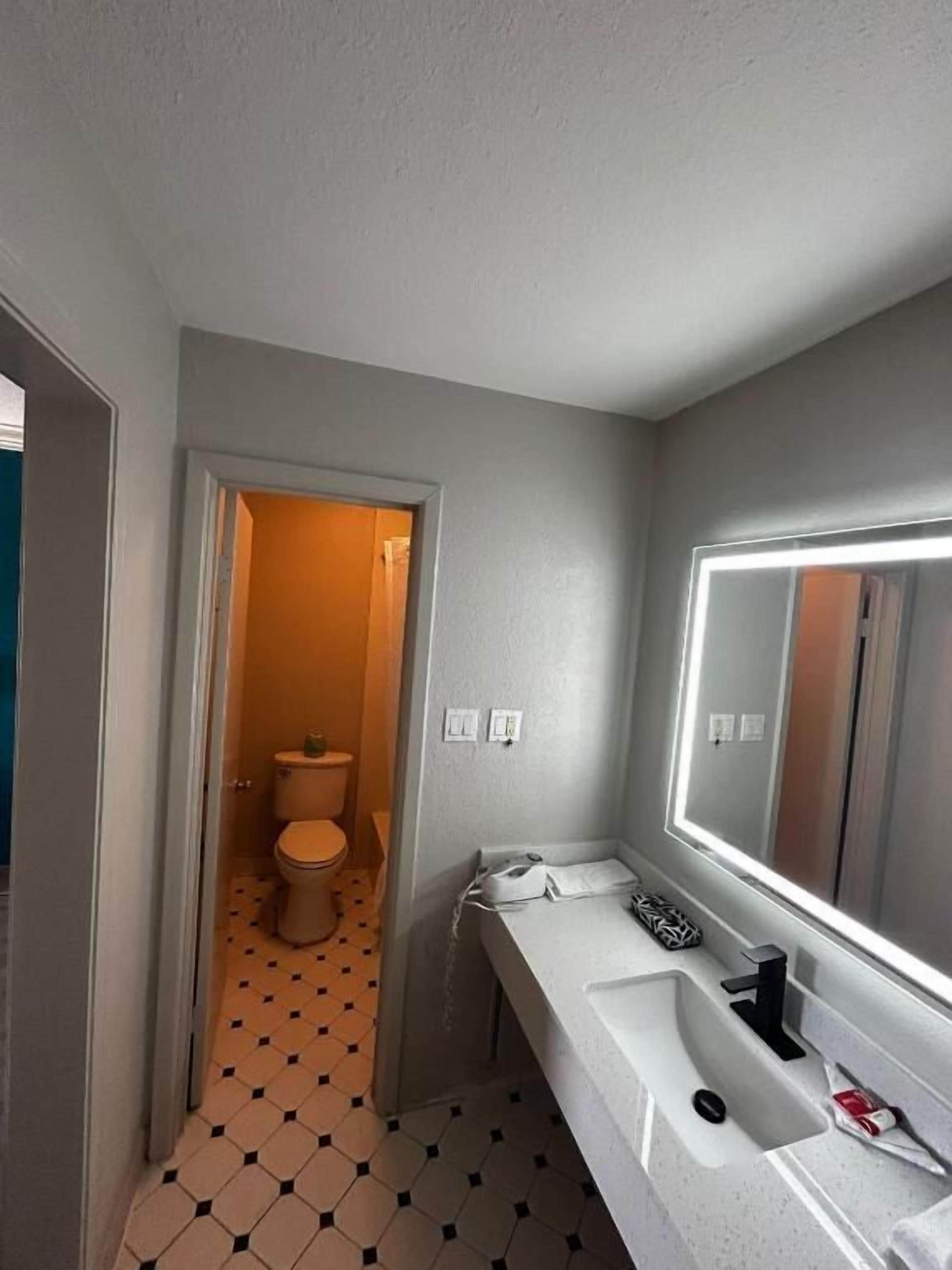 Bathtub, hair dryer, towels, soap