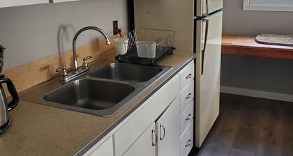 Charming 1-bedroom apt Buffalo WY, on creek, AC, WiFi, & 1 block from downtown.