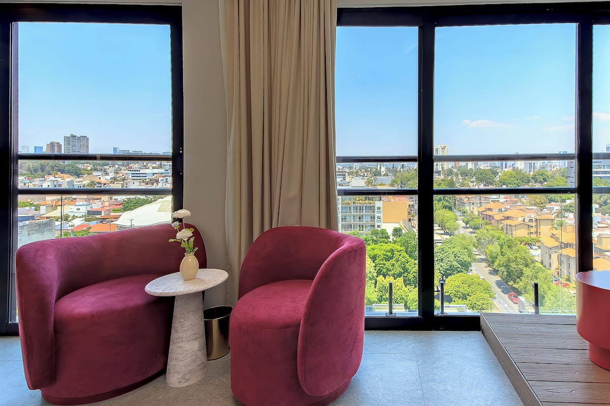 Deluxe Suite, City View | Premium bedding, down comforters, pillowtop beds, minibar