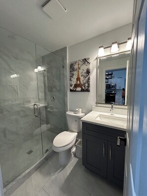 Shower, hair dryer, towels, soap