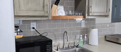 Fridge, microwave, stovetop, coffee/tea maker