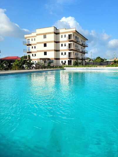 2-bedroom condo in Buccoo, Tobago with 2 Pools, AC, WiFi, Cable, 24hr Security
