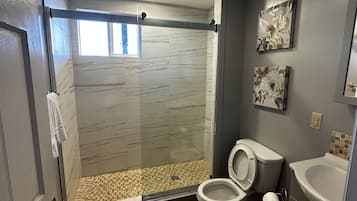 Shower, hair dryer, towels, soap