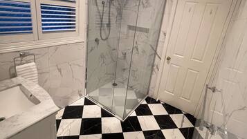 Shower, hair dryer, towels, soap