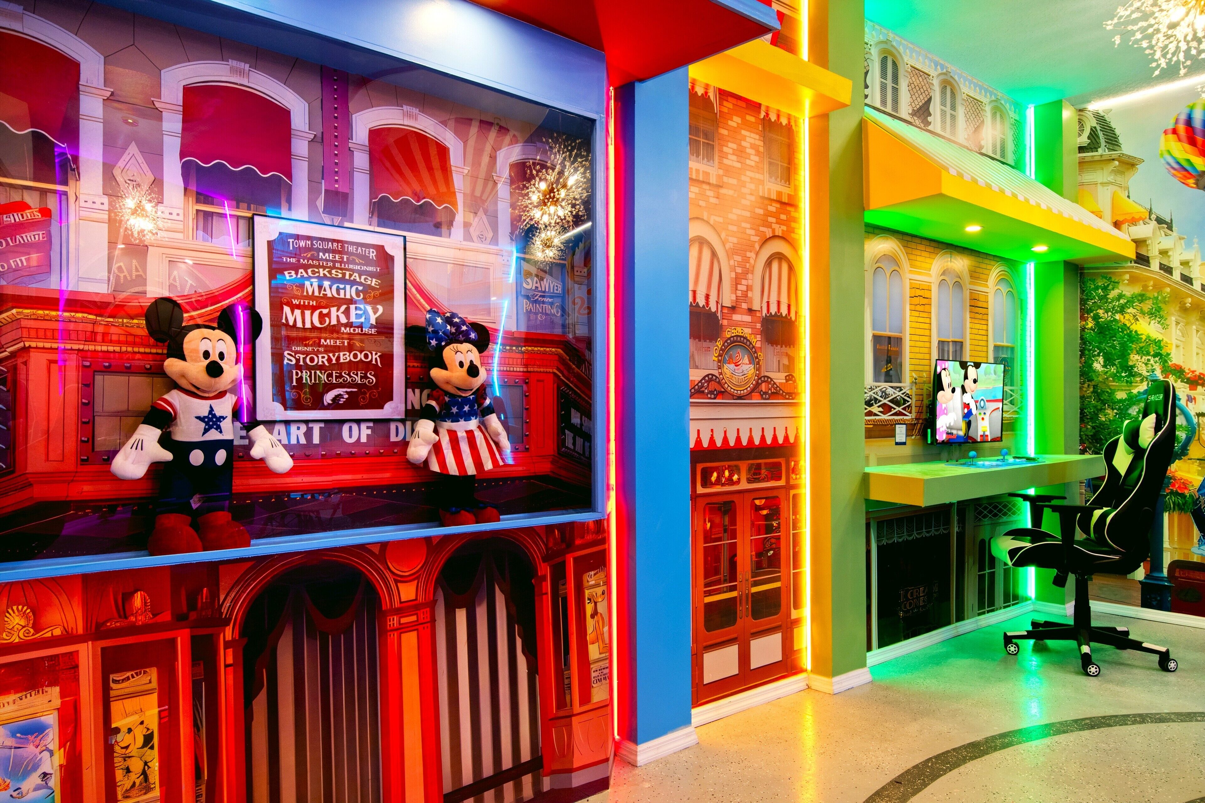 A themed area with Mickey Mouse and Minnie Mouse figures, a theater sign, and a colorful interior with a gaming chair.